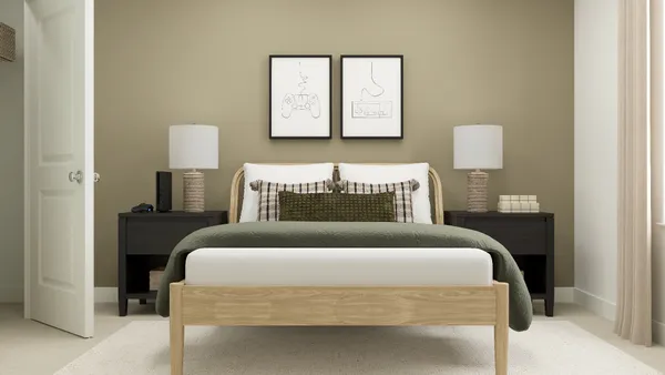 a bedroom with a bed and a night stand