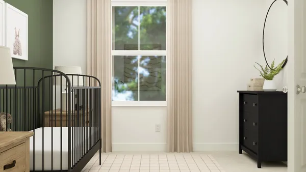 a view of a bedroom from a hallway