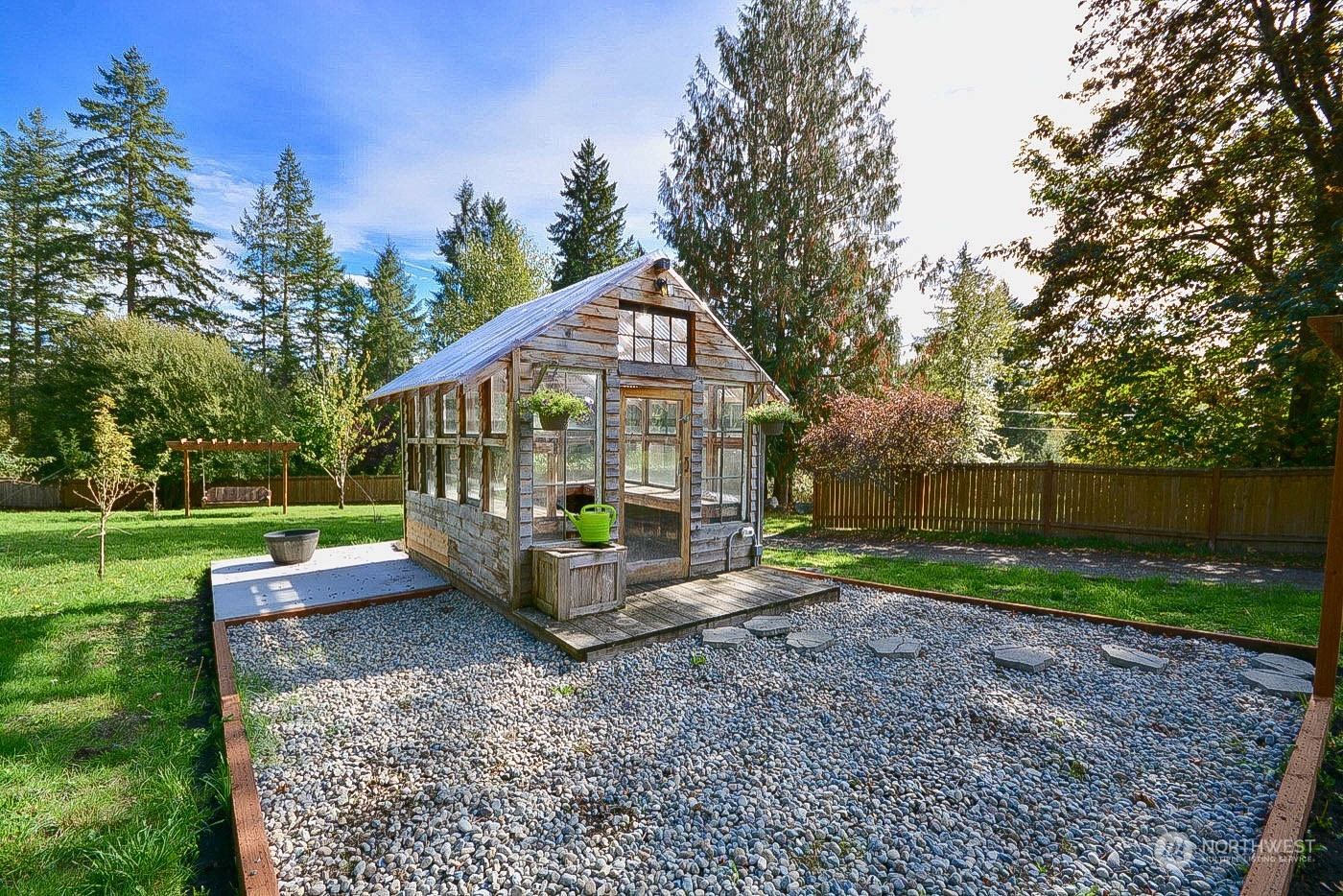 38304 Allen Road South Roy, WA 98580 - Photo 16 of 39 a view of a house with a yard and a garden