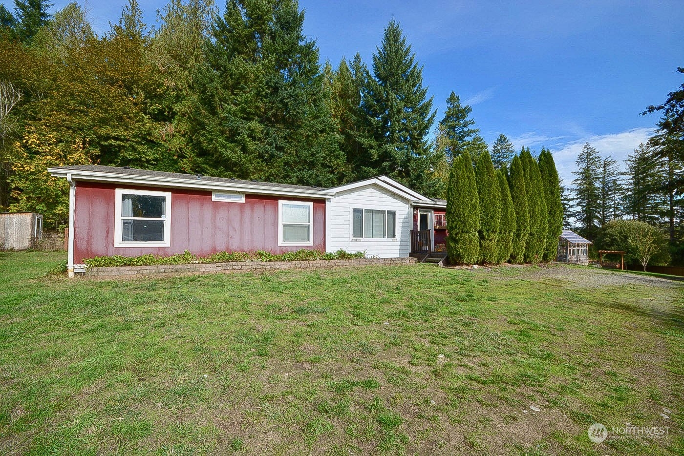 38304 Allen Road South Roy, WA 98580 - Photo 3 of 39 a yellow house with garden in front of it