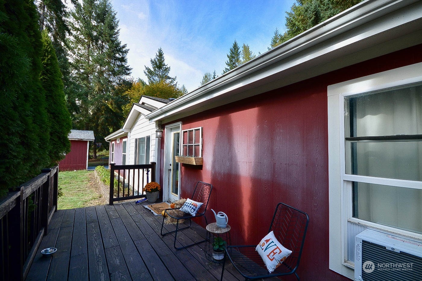 38304 Allen Road South Roy, WA 98580 - Photo 4 of 39 a balcony with wooden floor and outdoor seating