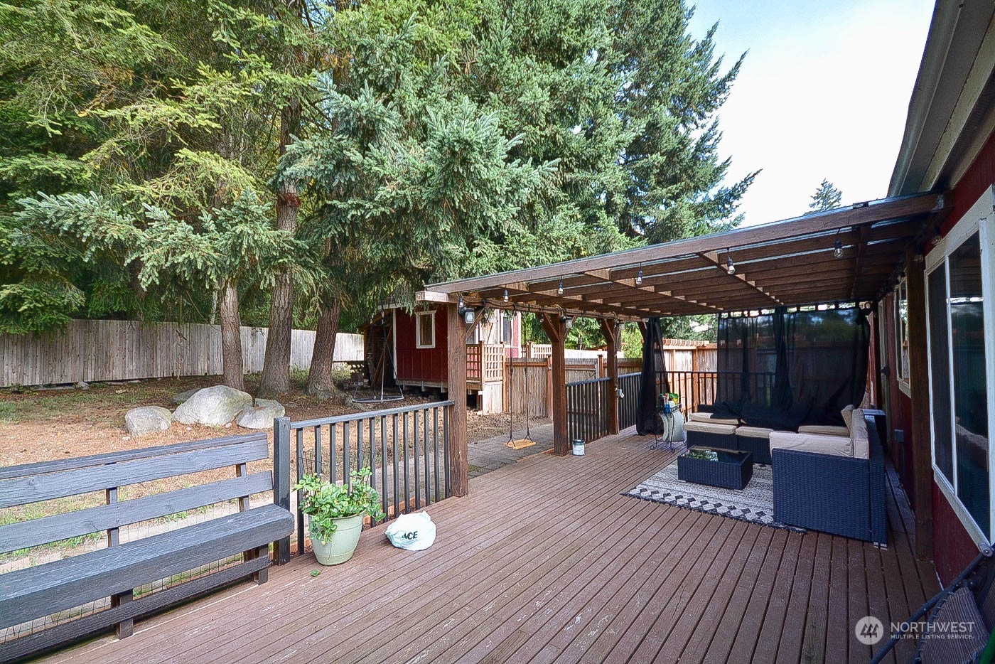 38304 Allen Road South Roy, WA 98580 - Photo 7 of 39 a view of a deck with furniture and a backyard