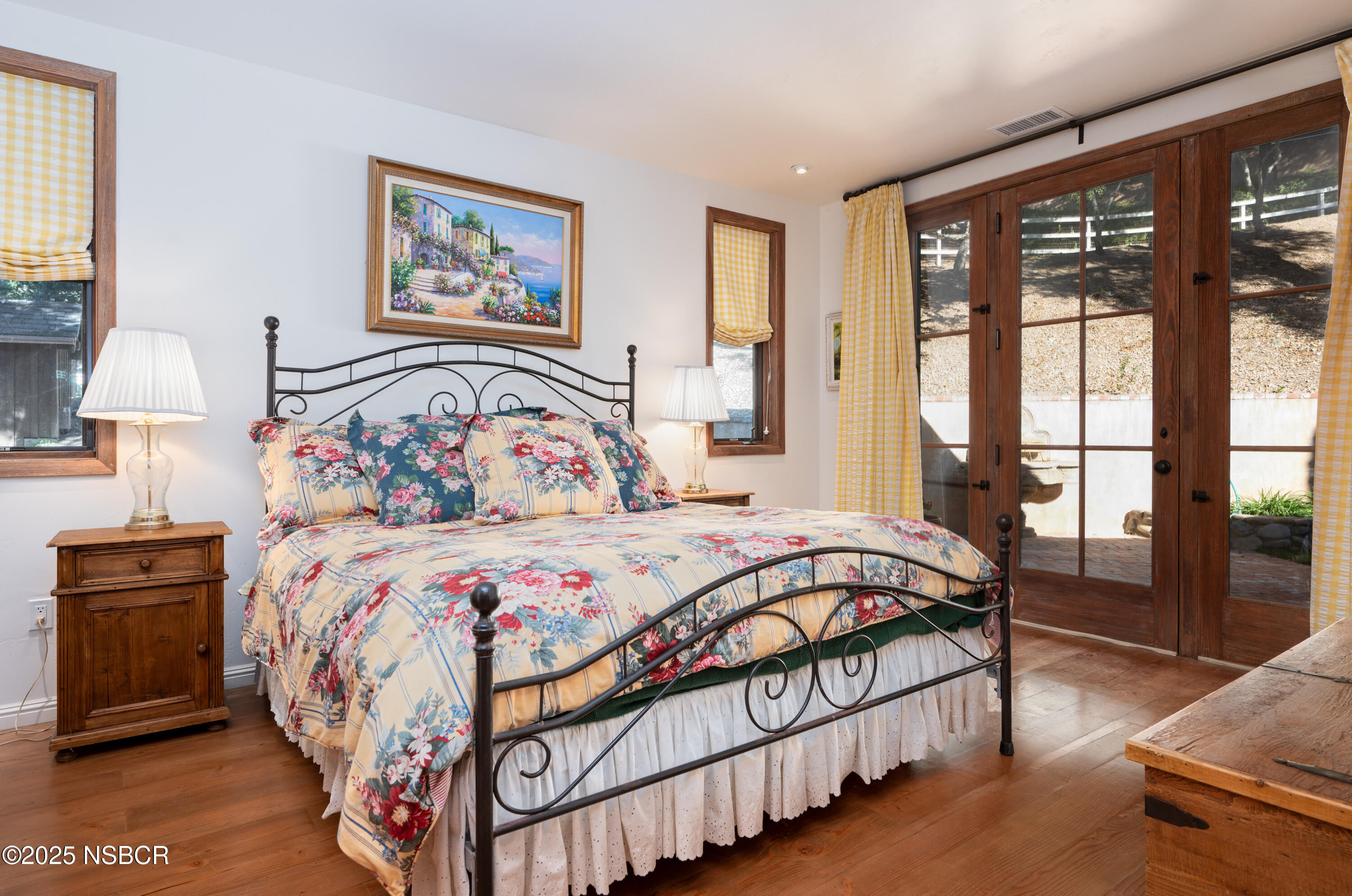 4086 East Oak Trail Road Santa Ynez, CA 93460 - Photo 34 of 57 a bedroom with a large bed and a lamp on table