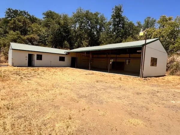 a house with trees in the background