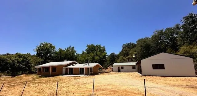 a walk in front of house with a yard