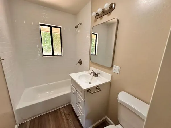 a bathroom with a sink toilet and tub