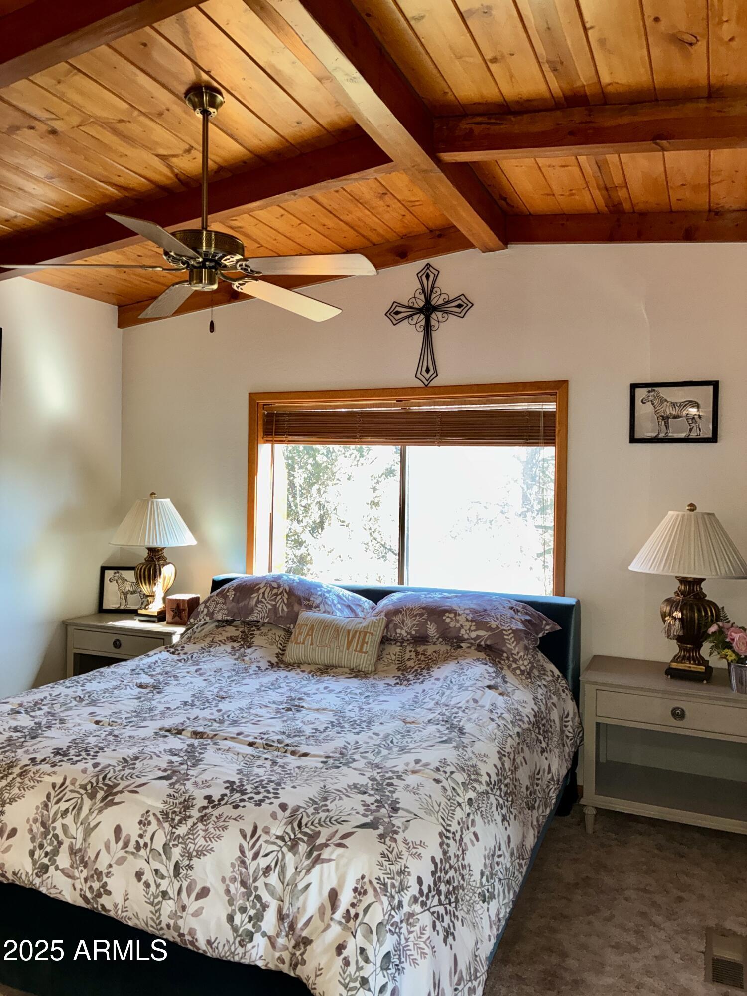 2761 Apollo Circle Overgaard, AZ 85933 - Photo 18 of 52 a bedroom with a bed and window