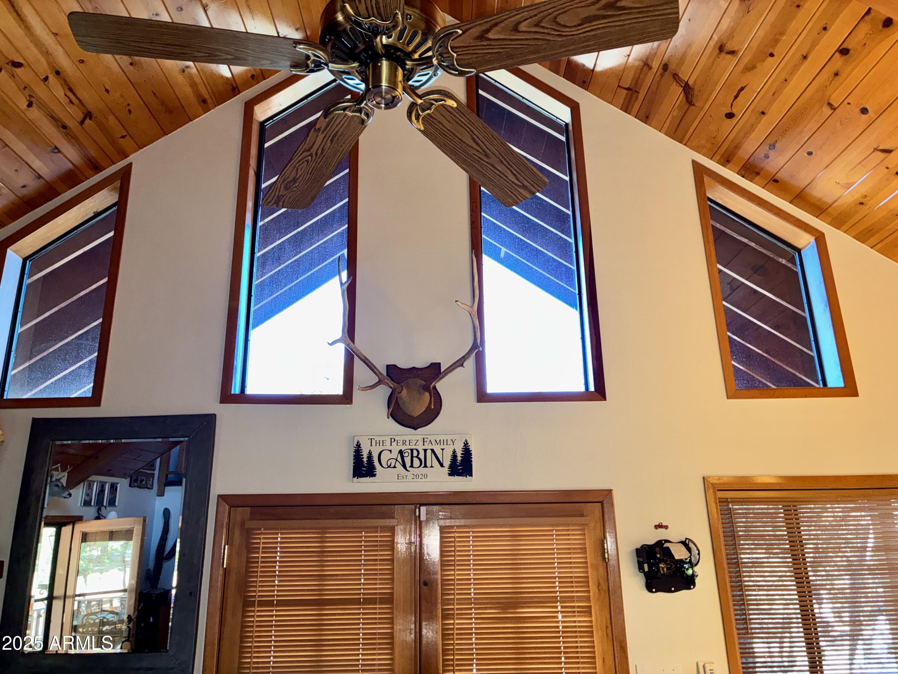 2761 Apollo Circle Overgaard, AZ 85933 - Photo 24 of 52 a front view of a building with glass windows