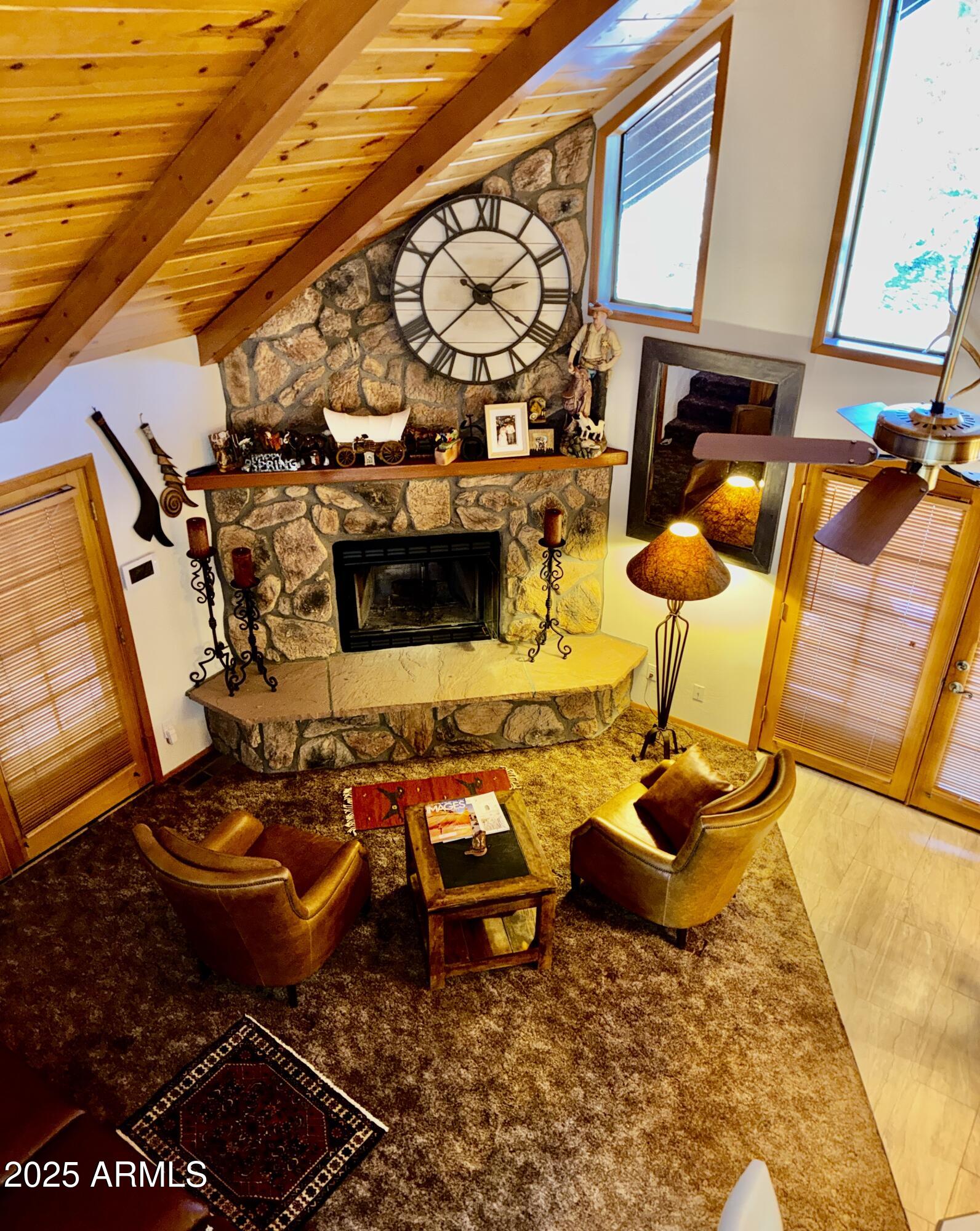 2761 Apollo Circle Overgaard, AZ 85933 - Photo 26 of 52 a blue swimming pool with chairs and wooden floor
