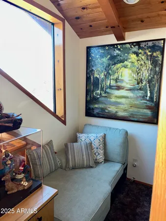 a view of balcony with furniture and potted plants