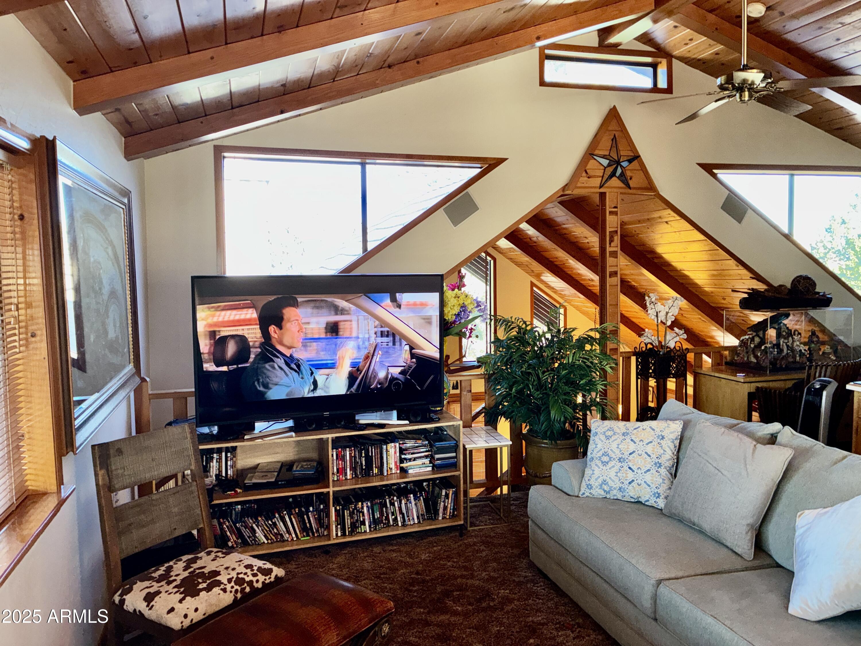 2761 Apollo Circle Overgaard, AZ 85933 - Photo 34 of 52 a living room with furniture and a flat screen tv