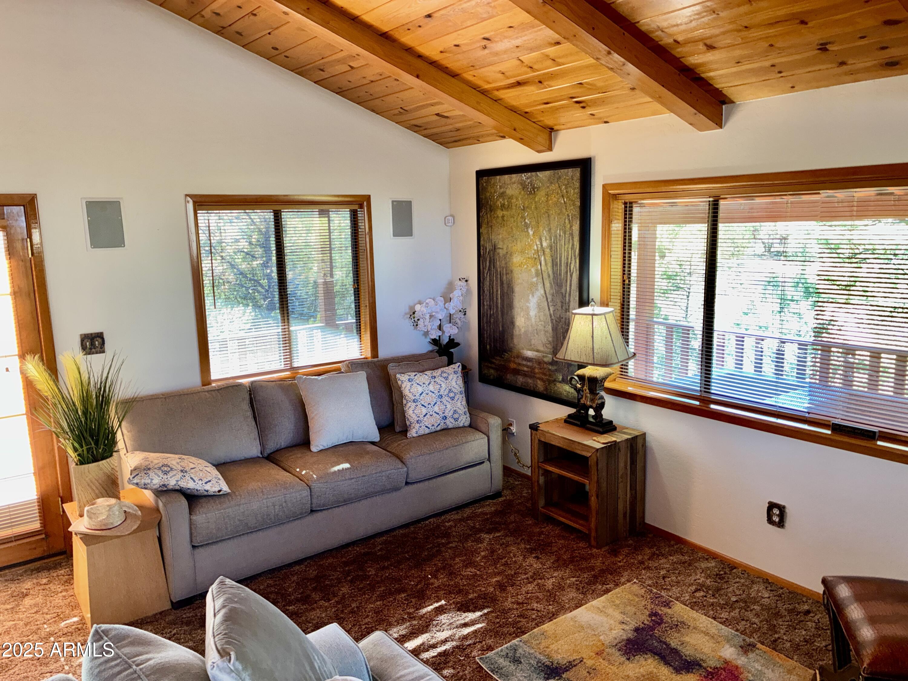 2761 Apollo Circle Overgaard, AZ 85933 - Photo 35 of 52 a living room with furniture and a large window