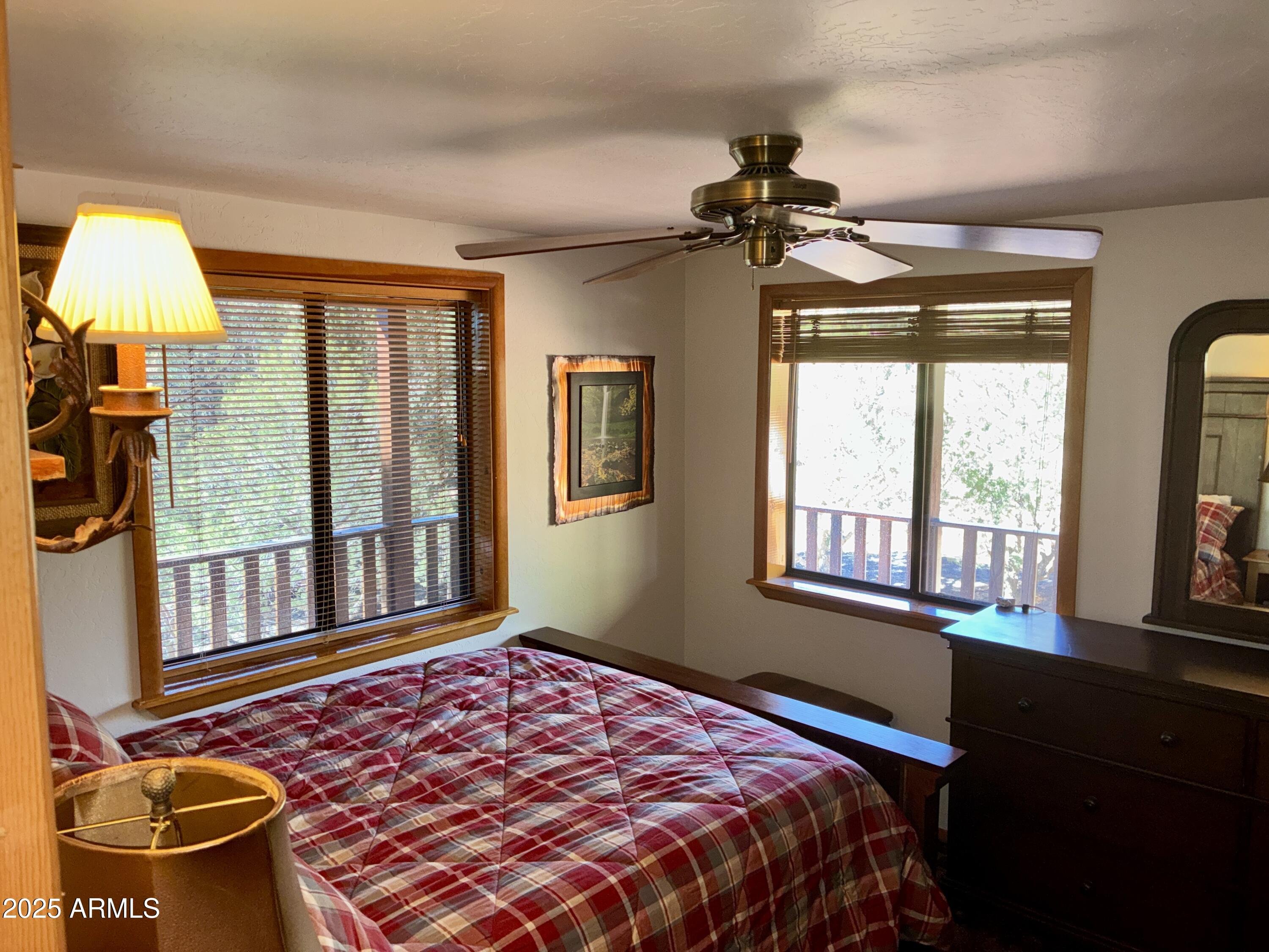 2761 Apollo Circle Overgaard, AZ 85933 - Photo 7 of 52 a bedroom with a bed and a window