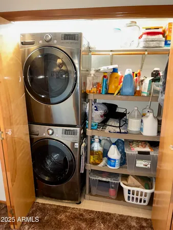 a utility room with stainless steel appliances and toys