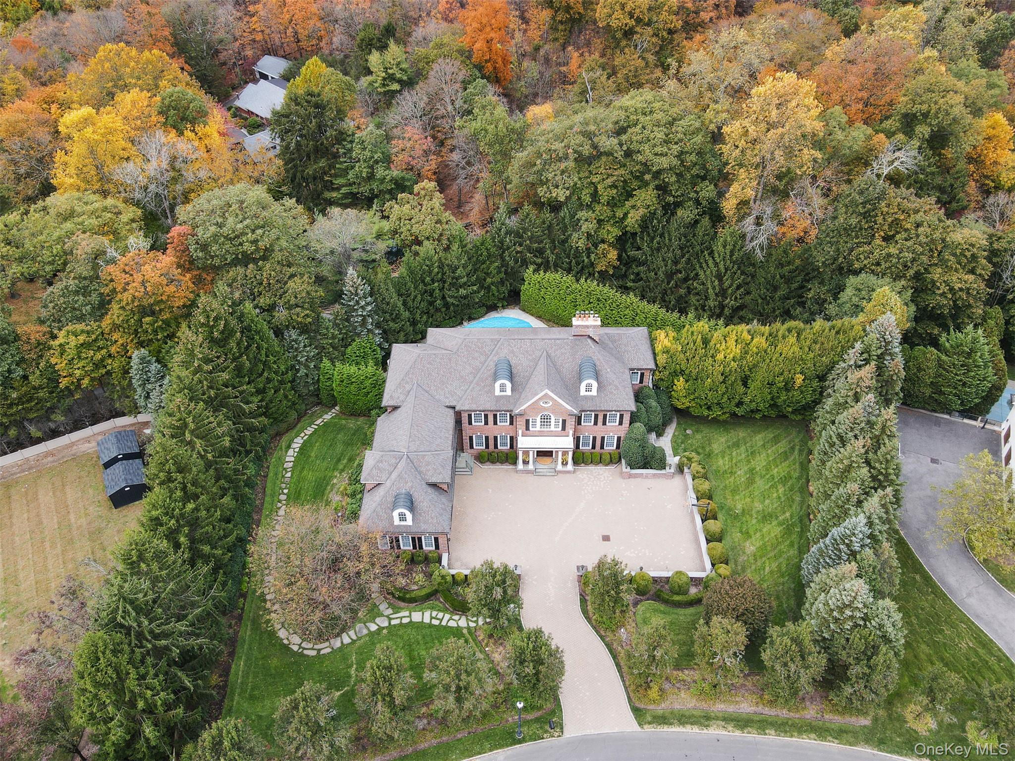 an aerial view of a house with yard