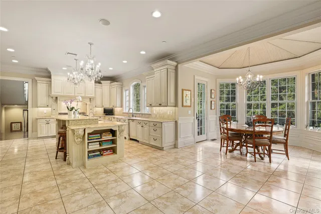 a view of kitchen with furniture and chandelier