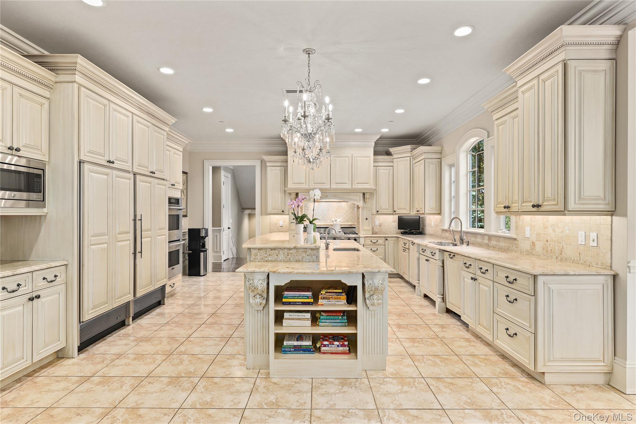 3 Brook View Lane Rye, NY 10580 - Photo 14 of 49 a large white kitchen with kitchen island granite countertop lots of white stainless steel appliances