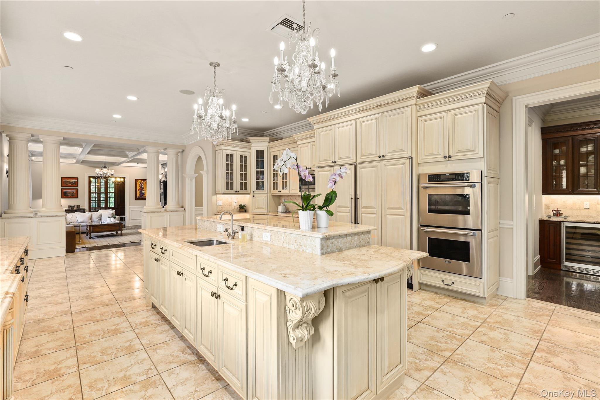 3 Brook View Lane Rye, NY 10580 - Photo 15 of 49 a kitchen with stainless steel appliances kitchen island granite countertop a refrigerator and a sink