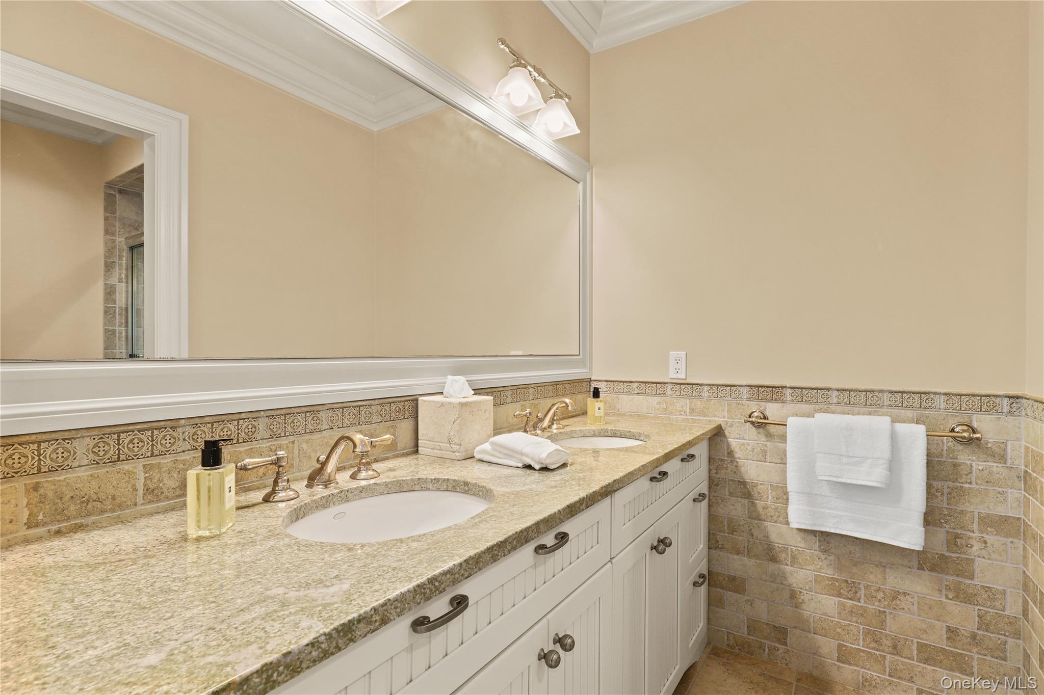 3 Brook View Lane Rye, NY 10580 - Photo 29 of 49 a bathroom with a double vanity sink and a mirror