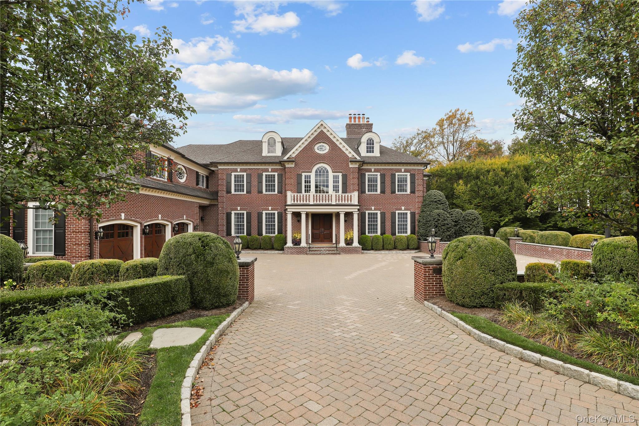 3 Brook View Lane Rye, NY 10580 - Photo 3 of 49 a front view of a house with a garden