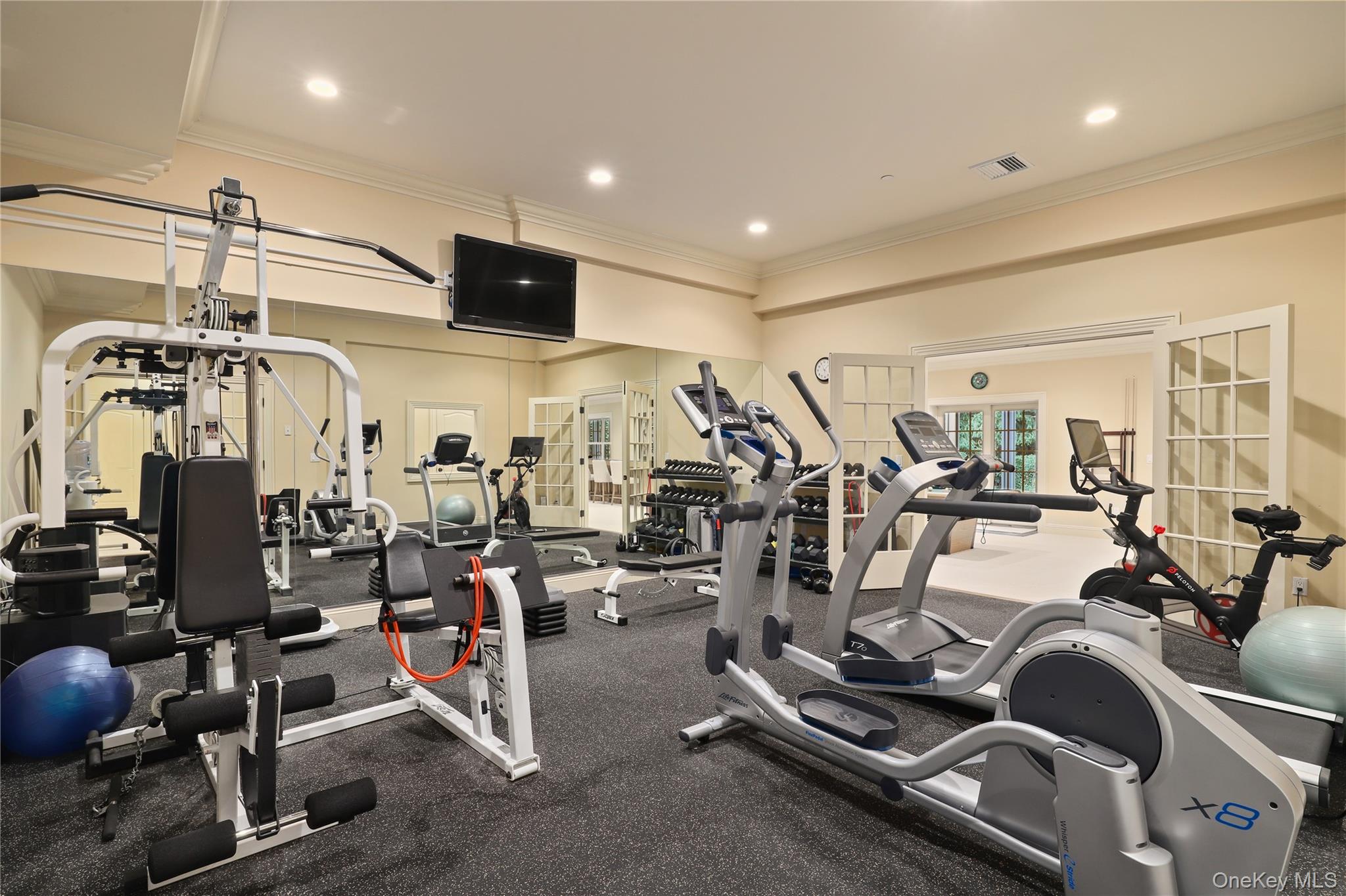 3 Brook View Lane Rye, NY 10580 - Photo 41 of 49 a view of a room with gym equipment