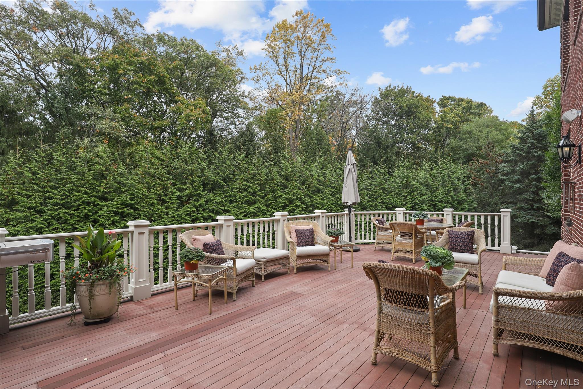 3 Brook View Lane Rye, NY 10580 - Photo 43 of 49 a view of a deck with chairs a barbeque with wooden floor and fence