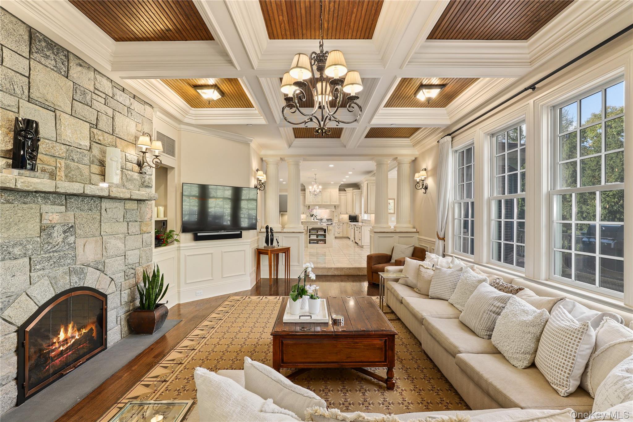 3 Brook View Lane Rye, NY 10580 - Photo 8 of 49 a living room with furniture a fireplace and a flat screen tv