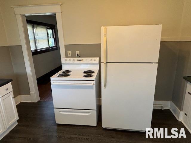 712 Roosevelt Avenue Kewanee, IL 61443 - Photo 15 of 21 a white refrigerator freezer and a stove sitting inside of a kitchen