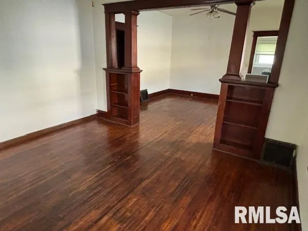 an entryway with wooden floor