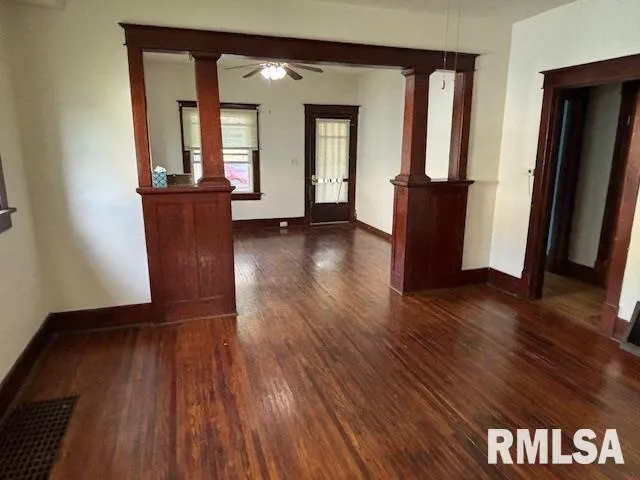 wooden floor in a hall with a window