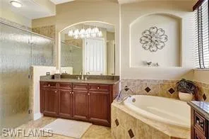 a bathroom with a bathtub and a sink