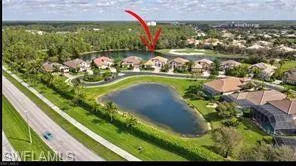 an aerial view of a residential houses with outdoor space and swimming pool