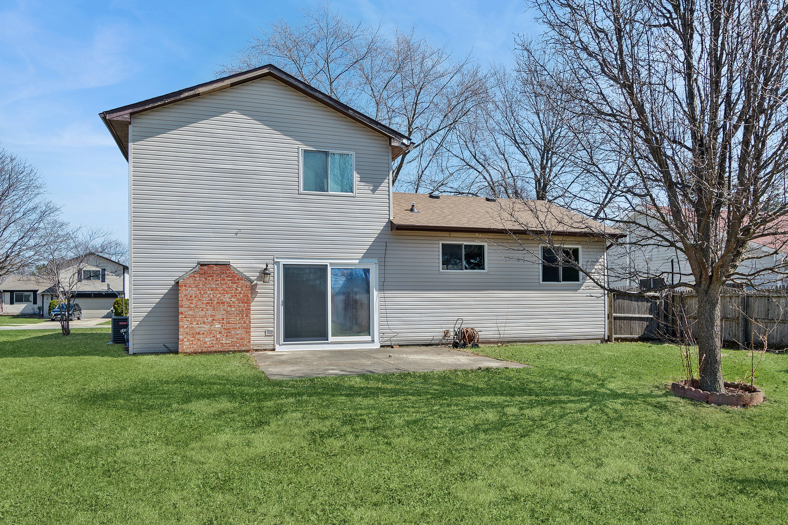 313 Thistle Drive Bolingbrook, IL 60490 - Photo 20 of 23 a front view of house with yard and trees