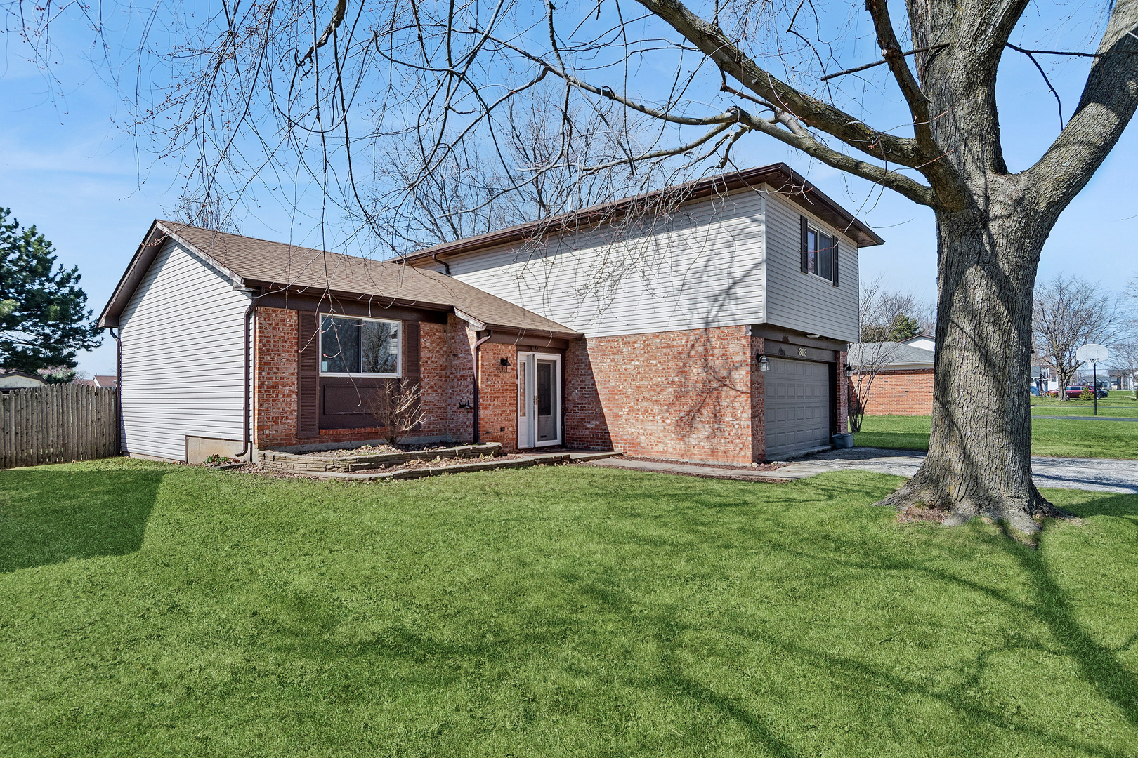 313 Thistle Drive Bolingbrook, IL 60490 - Photo 23 of 23 a house view with a garden space