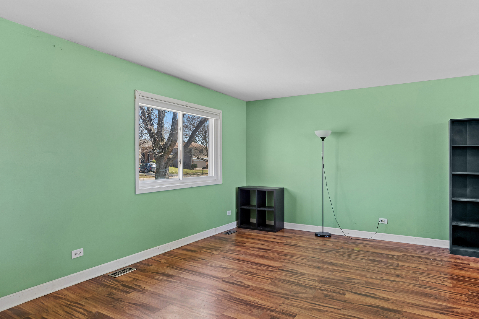 313 Thistle Drive Bolingbrook, IL 60490 - Photo 3 of 23 a view of empty room with window and hardwood