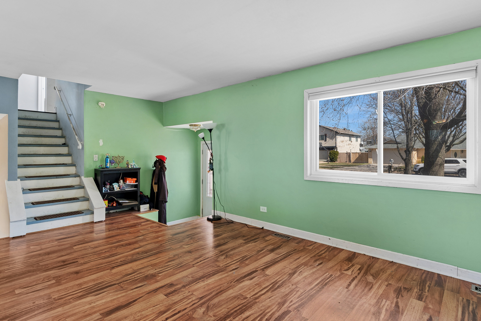 313 Thistle Drive Bolingbrook, IL 60490 - Photo 7 of 23 a view of a room with toys and wooden floor