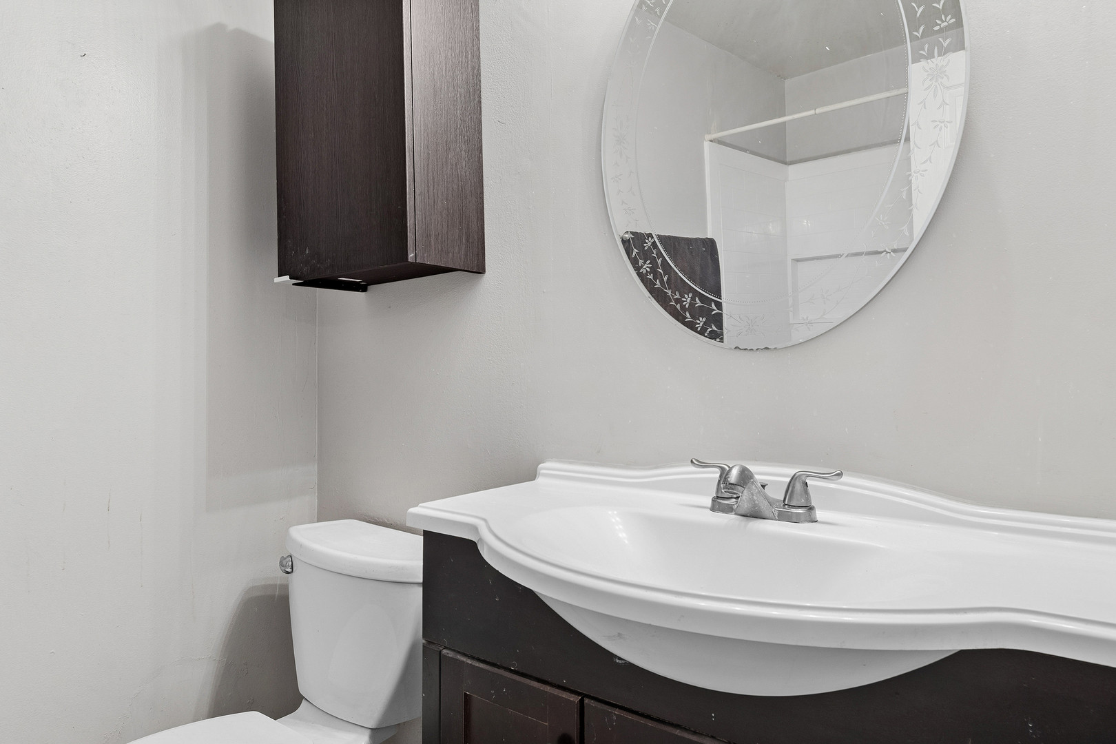 313 Thistle Drive Bolingbrook, IL 60490 - Photo 9 of 23 a bathroom with a sink a toilet and mirror