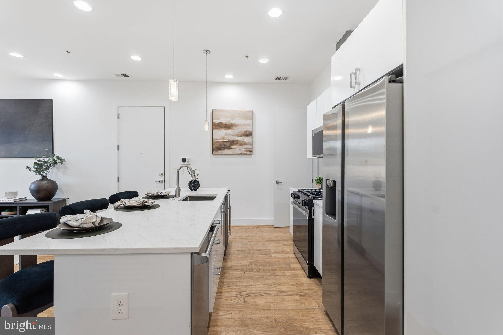 1837 Kalorama Road Northwest, Unit F Washington, DC 20009 - Photo 3 of 42 Modern kitchen with sleek finishes.