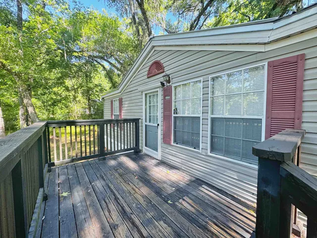 a porch with seating space and yard