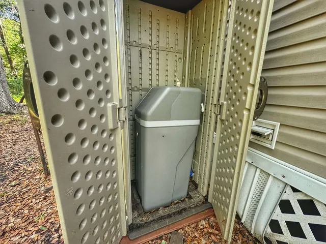 a bathroom with a toilet and shower