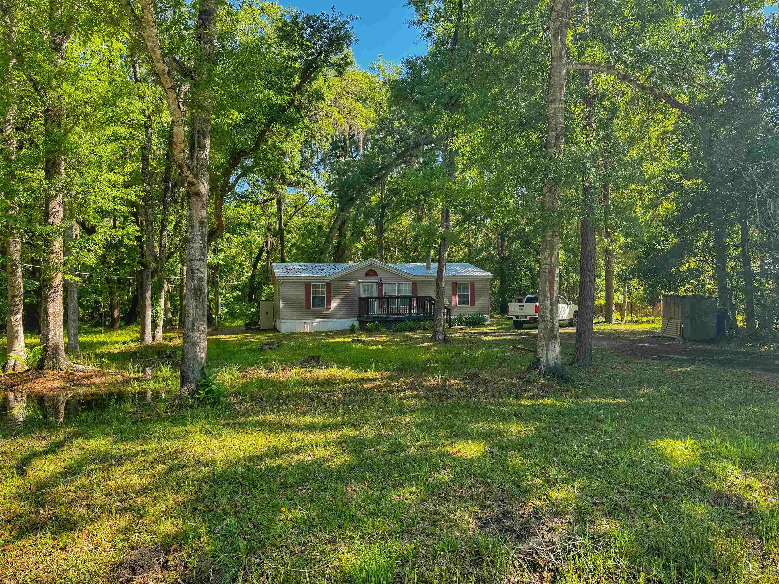 5872 Pine Creek Drive St. Augustine, FL 32092 - Photo 26 of 26 a backyard of a house with lots of green space