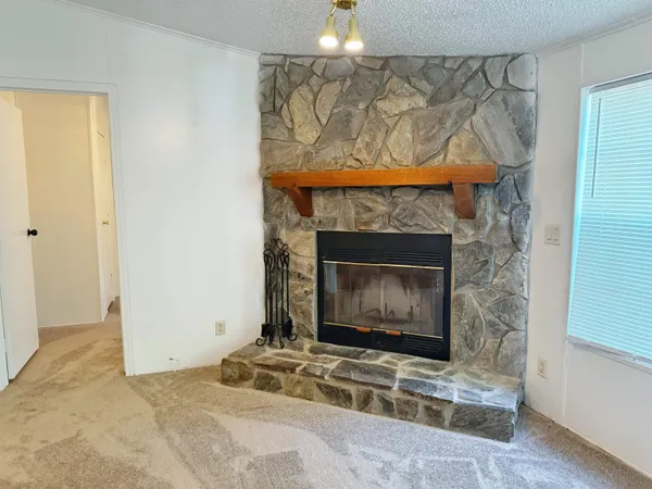 a living room with a fireplace