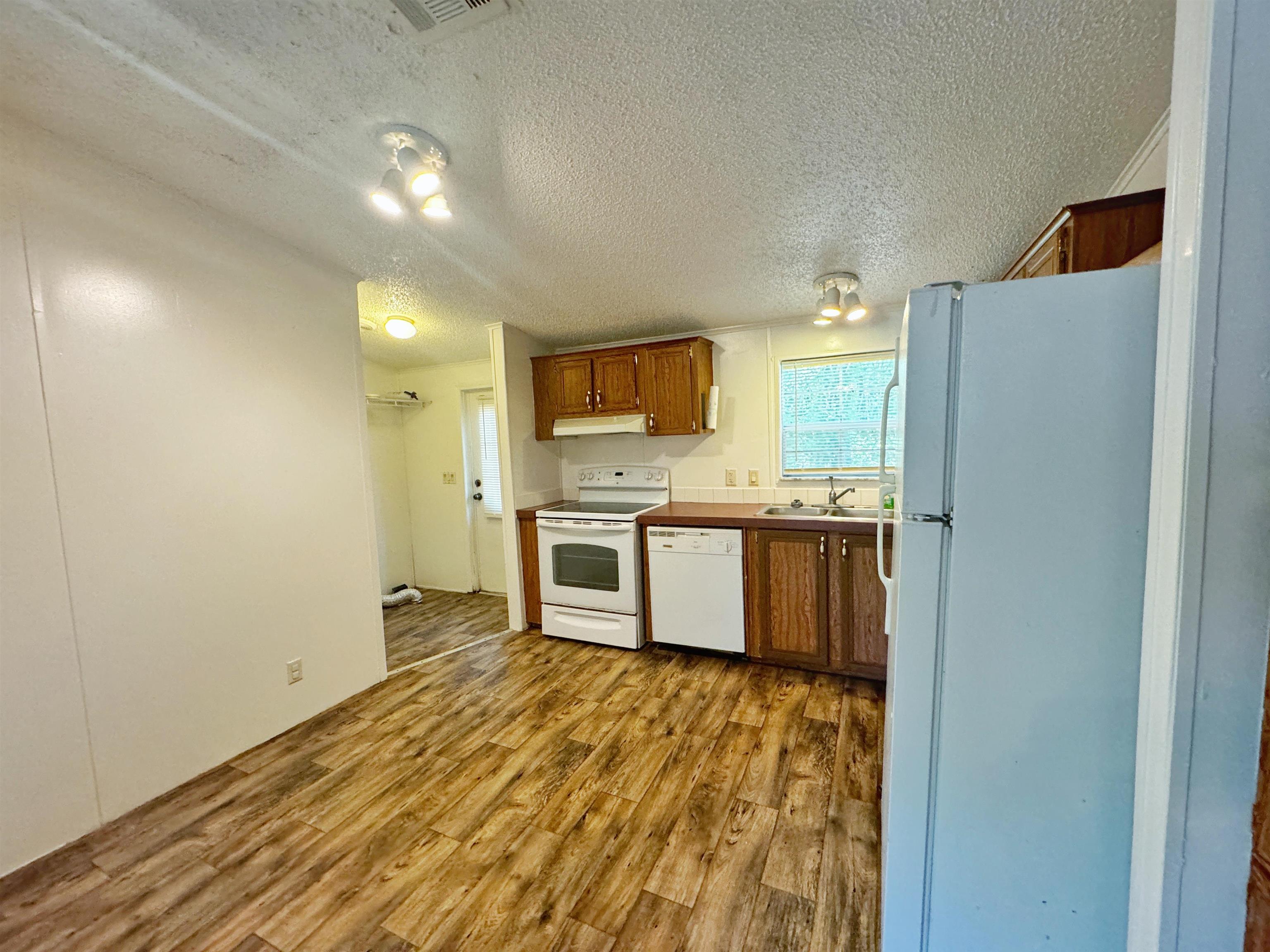 5872 Pine Creek Drive St. Augustine, FL 32092 - Photo 7 of 26 a kitchen with stainless steel appliances a refrigerator and a stove top oven