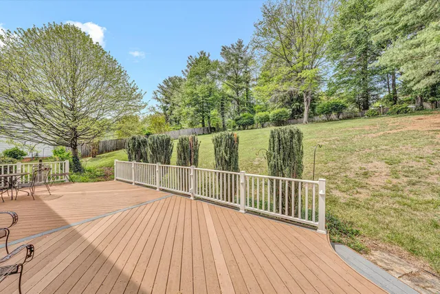 a view of deck with wooden floor and fence