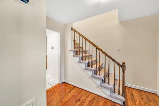 a view of an entryway with wooden floor