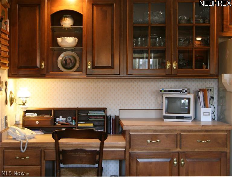 3404 Bancroft Road Akron, OH 44333 - Photo 8 of 24 The kitchen has a very useful planning desk with even more storage.