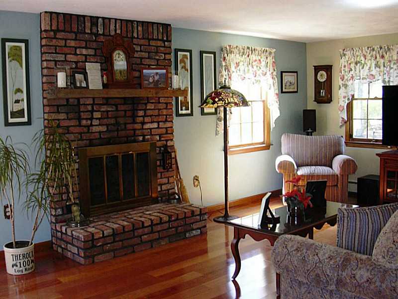100 Log Road North Smithfield, RI 02830 - Photo 9 of 24 Living Room. Beautiful Brick Fireplace and gleaming Hardwood Floors!