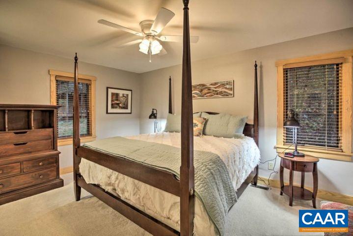 280 Fawn Ridge Drive Wintergreen, VA 22967 - Photo 12 of 23 a bed room with a bed and a chandelier