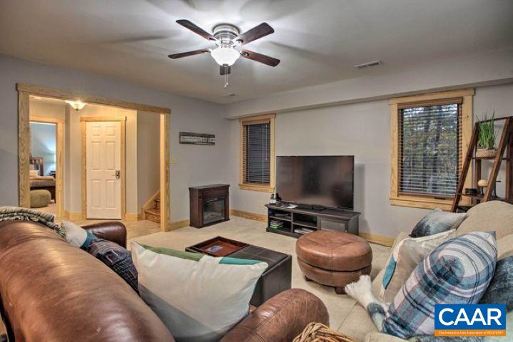 280 Fawn Ridge Drive Wintergreen, VA 22967 - Photo 20 of 23 a living room with furniture and a flat screen tv