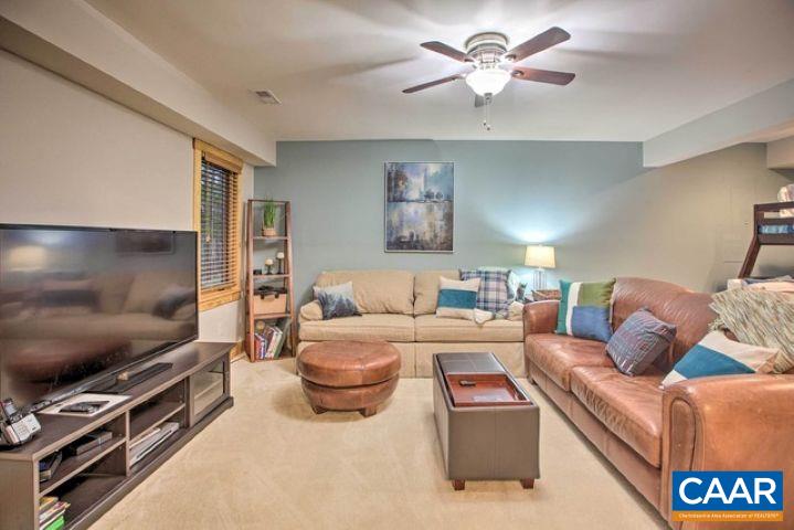 280 Fawn Ridge Drive Wintergreen, VA 22967 - Photo 21 of 23 a living room with furniture and a flat screen tv